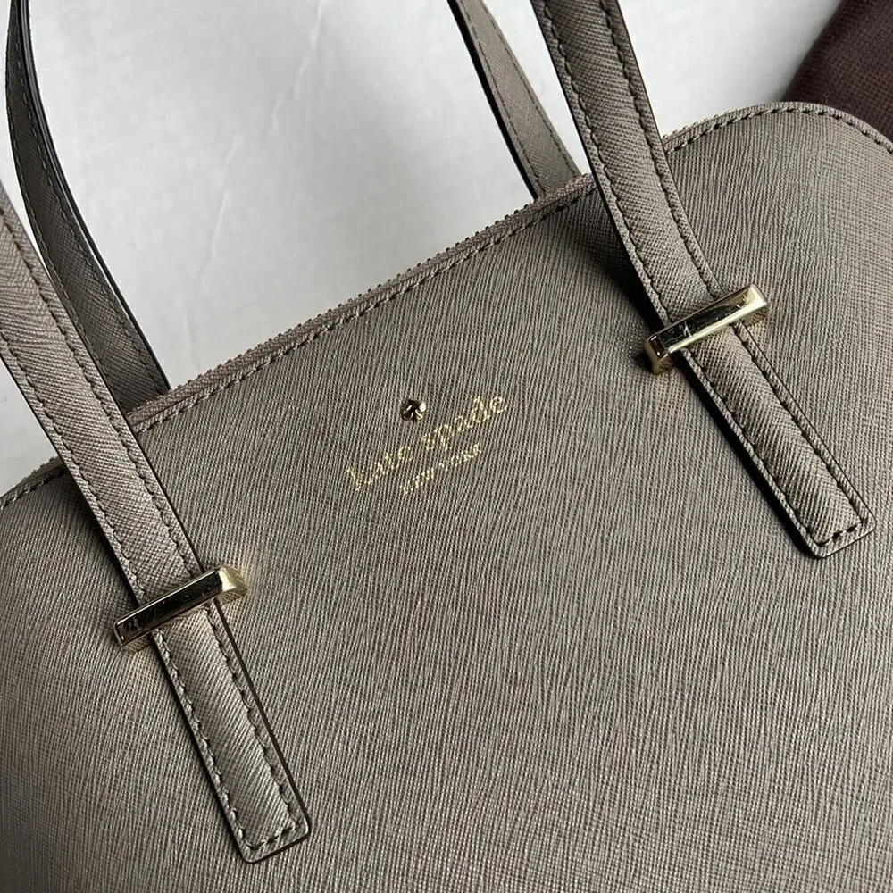 Kate Spade Cedar Street Maise Satchel in a shade of grey or taupe.